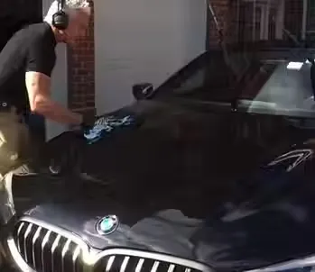 Detailer working on a vehicle interior