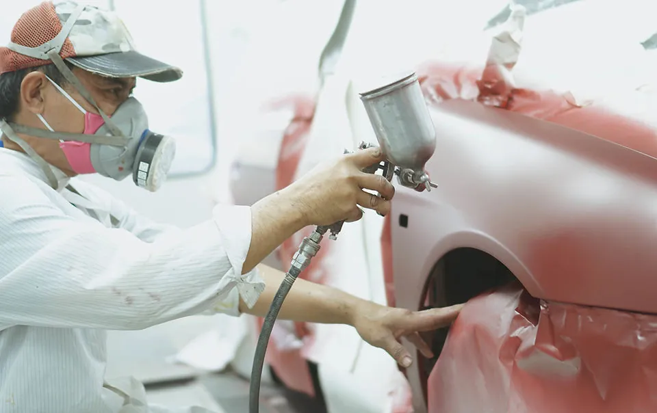 Mechanic Working on Car