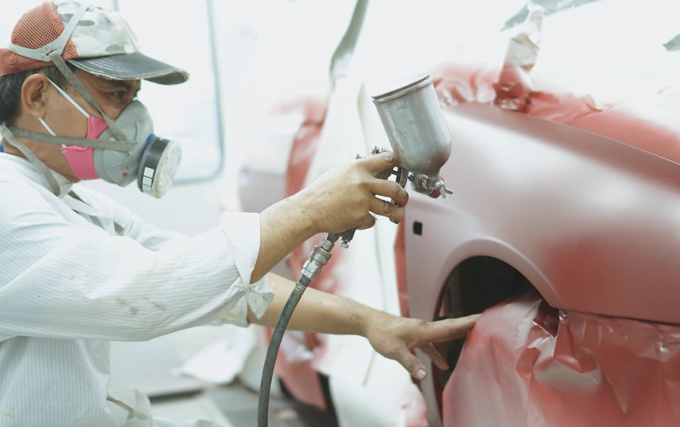 Mechanic Working on Car